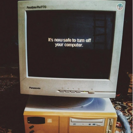 An image of an old computer, probably from the '80s or '90s, with a screen showing simple black on white text "it is now safe to turn off your computer"