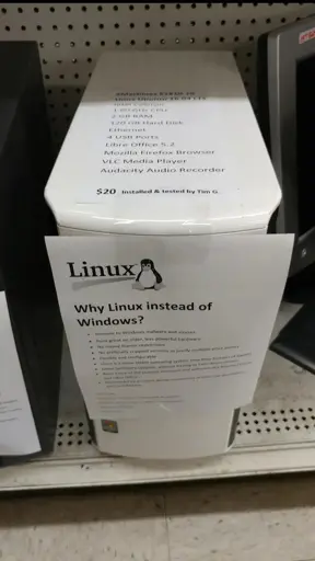 Image of an old desktop with paper taped into it saying "Why Linux instead of Windows" 